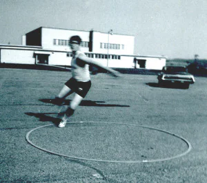 Discus Boy Mike Ziants practicing hurling that thing, after school, 1970